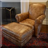 F05. Brown leather chair and ottoman from Lee Industries. 38”h x 36”w x 38”d 